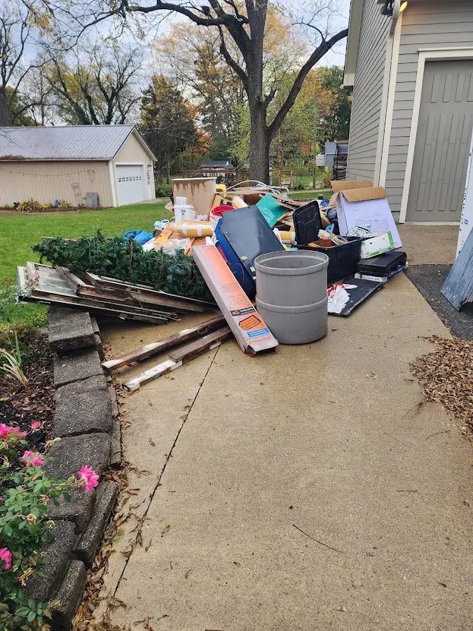 Dumpster being loaded with debris for 3 Yard Dumpster Rental in Dayton